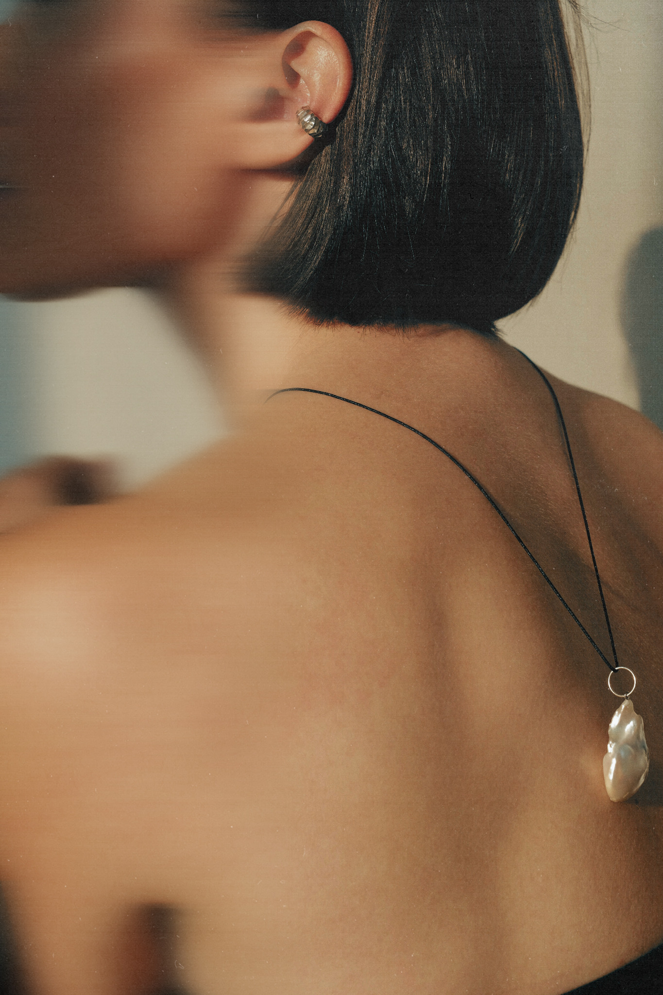 Jewellery brand photograph with a pearl pendant